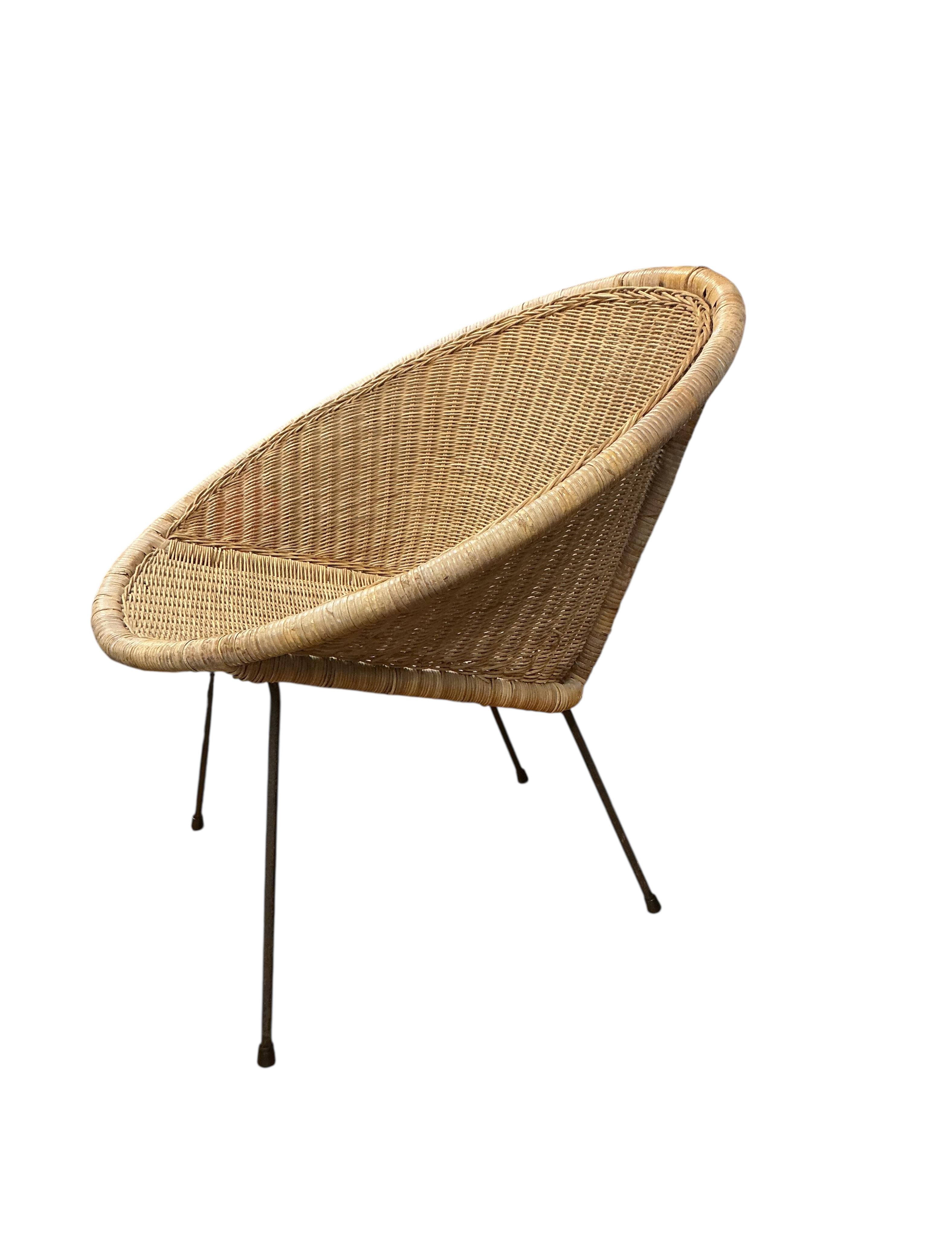 A mid century cane chair, width 74cm, height 73cm